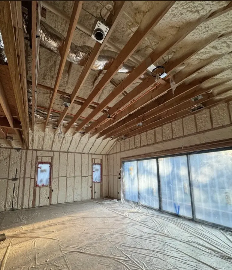 Interior walls and ceiling insulated with spray foam during new construction in Midland